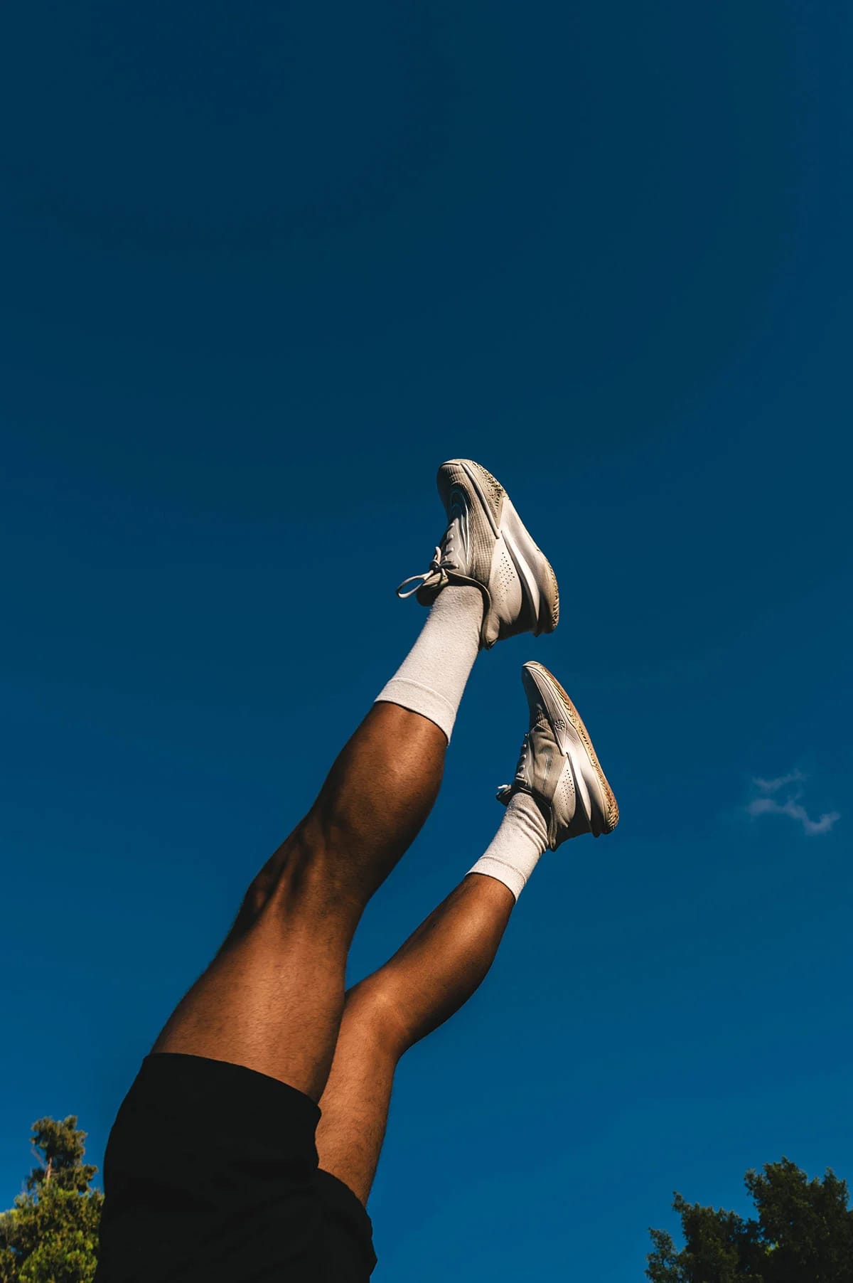 Close-up of parkour athlete's legs