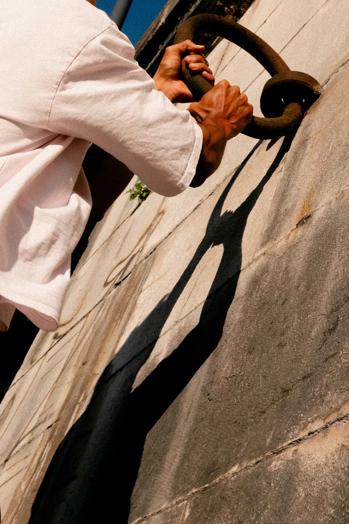 Shadow of a person's hands on a wall