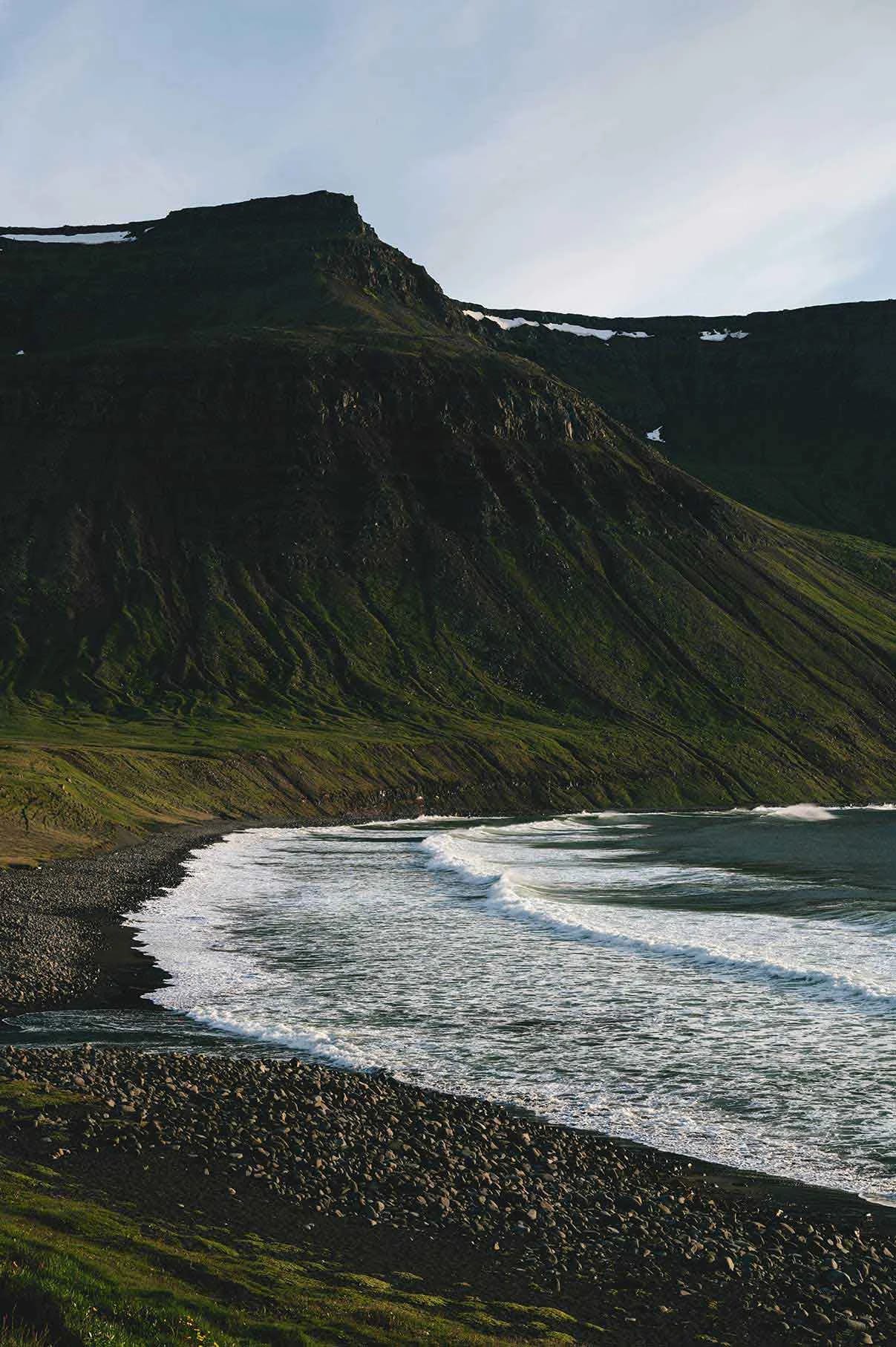 Beach and green mountain in Iceland