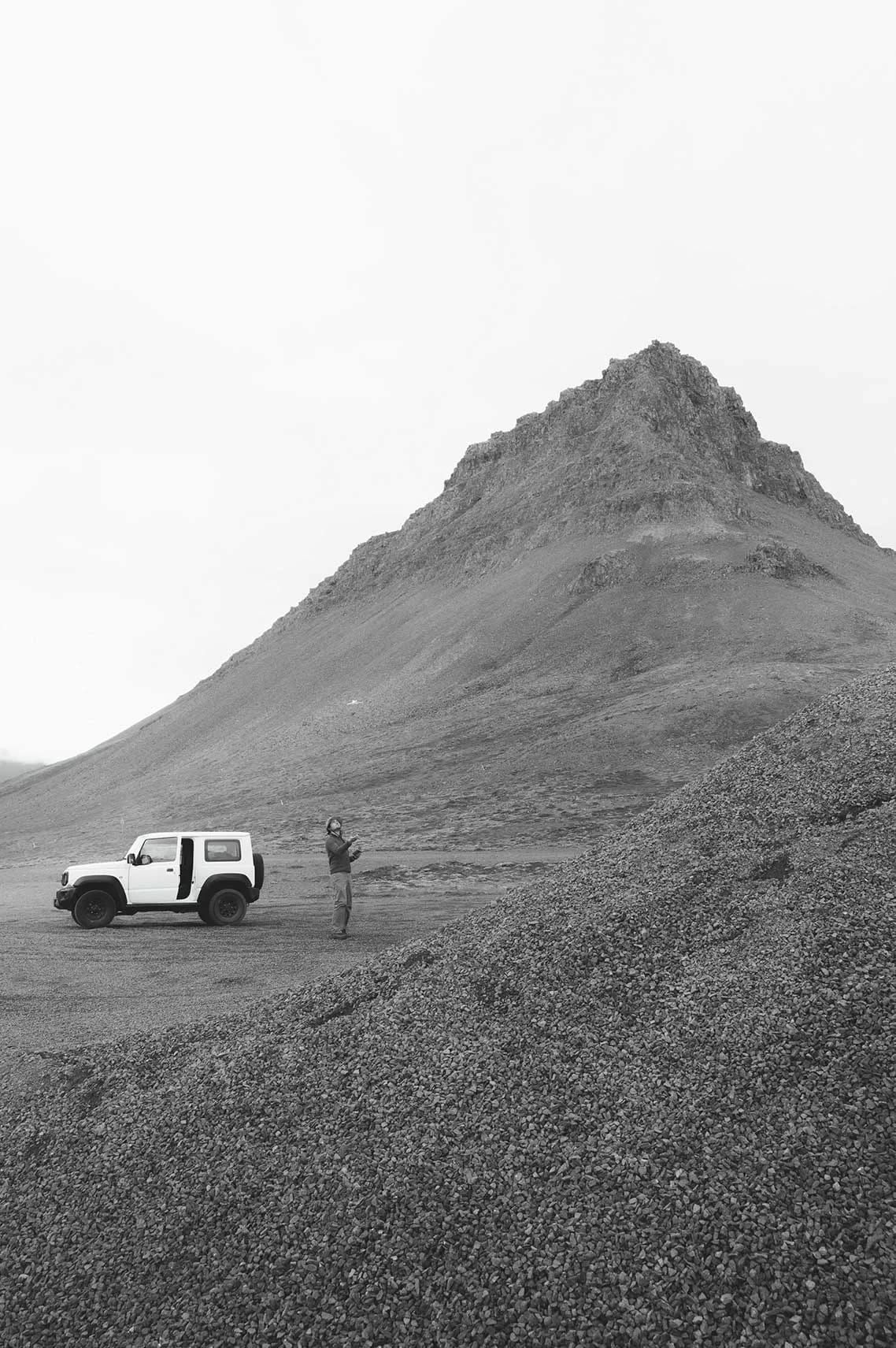 Man with a jeep in the mountains