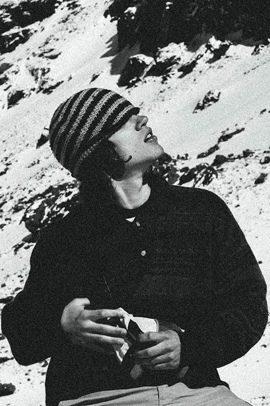 Man looking up at the mountain